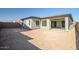 Large backyard with covered patio and new construction at 20105 W Campbell Ave, Buckeye, AZ 85396