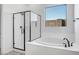 Modern bathroom with soaking tub and walk-in shower at 20105 W Campbell Ave, Buckeye, AZ 85396