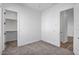 Well-lit bedroom with carpet flooring and walk-in closet at 20105 W Campbell Ave, Buckeye, AZ 85396