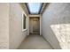 Covered entryway with light walls and a neutral door at 20105 W Campbell Ave, Buckeye, AZ 85396