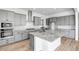 Modern kitchen with gray cabinets and granite countertops at 20105 W Campbell Ave, Buckeye, AZ 85396