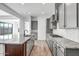 Modern kitchen with gray cabinets, granite counters, and island at 20105 W Campbell Ave, Buckeye, AZ 85396