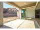 Spacious patio with sliding glass doors leading to backyard at 20105 W Campbell Ave, Buckeye, AZ 85396