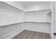 Spacious walk-in closet with ample shelving and hanging rods at 20105 W Campbell Ave, Buckeye, AZ 85396