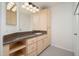 Bathroom with vanity, granite counter, and a decorative lighting fixture at 20801 N 90Th Pl # 222, Scottsdale, AZ 85255