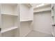 Well-organized walk-in closet with shelving and clothing rods at 20801 N 90Th Pl # 222, Scottsdale, AZ 85255