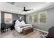 Main bedroom with ceiling fan, large windows, and ensuite bathroom at 31101 N 136Th Ln, Peoria, AZ 85383