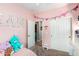 bedroom with pink walls, toys and a vanity at 31101 N 136Th Ln, Peoria, AZ 85383