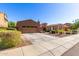 Lovely home with a two-car garage and well-manicured landscaping at 31101 N 136Th Ln, Peoria, AZ 85383