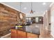 Kitchen island with granite countertops and view of living area at 31101 N 136Th Ln, Peoria, AZ 85383