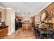 Spacious kitchen with island, stainless steel appliances, and wood-look feature wall at 31101 N 136Th Ln, Peoria, AZ 85383