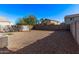 Gravel backyard featuring desert landscaping and a block privacy wall at 36375 W Picasso St, Maricopa, AZ 85138