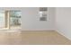 Bedroom featuring tile floors, neutral paint, and a large window at 36375 W Picasso St, Maricopa, AZ 85138