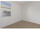 Bedroom featuring a bright window and neutral carpet at 36375 W Picasso St, Maricopa, AZ 85138