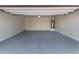 Spacious garage with epoxy floors and water heater at 36375 W Picasso St, Maricopa, AZ 85138