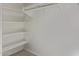 Walk-in closet featuring white shelving, rod and ample space at 36375 W Picasso St, Maricopa, AZ 85138