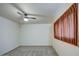 Well-lit bedroom with ceiling fan and window coverings at 3753 S Mill Ave, Tempe, AZ 85282