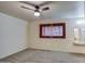 Spacious bedroom with ceiling fan and large window at 3753 S Mill Ave, Tempe, AZ 85282