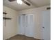 Bedroom with spacious closet featuring bi-fold doors at 3753 S Mill Ave, Tempe, AZ 85282