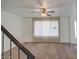 Bright living room featuring carpet, large window, and ceiling fan at 3753 S Mill Ave, Tempe, AZ 85282