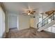 Living room with ceiling fan and carpeted floors at 3753 S Mill Ave, Tempe, AZ 85282