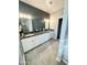 Main bathroom with double vanity, granite countertop, and tile floor at 49005 N 7Th Ave, New River, AZ 85087