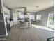 Modern kitchen with island, stainless steel appliances, and tile floors at 49005 N 7Th Ave, New River, AZ 85087