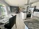 Modern kitchen featuring stainless steel appliances and an island at 49005 N 7Th Ave, New River, AZ 85087