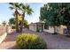 Backyard view with gravel, trees, and fence at 5022 E Magic Stone Dr, Phoenix, AZ 85044