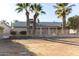 Backyard view of home with gravel and trees at 5022 E Magic Stone Dr, Phoenix, AZ 85044