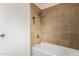 Clean bathroom with tile shower/tub combo at 5022 E Magic Stone Dr, Phoenix, AZ 85044