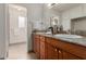 Bathroom boasts double vanity with granite countertop at 5022 E Magic Stone Dr, Phoenix, AZ 85044