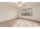 Bright bedroom with ceiling fan and large window at 5022 E Magic Stone Dr, Phoenix, AZ 85044