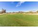 Green golf course with distant mountain view at 5022 E Magic Stone Dr, Phoenix, AZ 85044