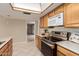 Kitchen with stainless steel appliances and light wood cabinets at 5022 E Magic Stone Dr, Phoenix, AZ 85044