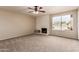 Living room featuring a fireplace and sliding glass doors at 5022 E Magic Stone Dr, Phoenix, AZ 85044