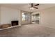 Living room with a fireplace, sliding glass doors and a view at 5022 E Magic Stone Dr, Phoenix, AZ 85044