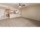 Living room with kitchen pass-through and carpet flooring at 5022 E Magic Stone Dr, Phoenix, AZ 85044