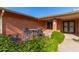 Small patio with wrought iron furniture and lush landscaping at 5022 E Magic Stone Dr, Phoenix, AZ 85044