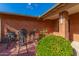 Small patio with wrought iron furniture near the front entrance at 5022 E Magic Stone Dr, Phoenix, AZ 85044