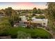 Aerial view of a beautiful home with a large backyard, pool, and spa at 6501 E Cholla St, Scottsdale, AZ 85254