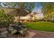 Outdoor dining area in a beautifully landscaped backyard at 6501 E Cholla St, Scottsdale, AZ 85254