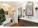 Spa-like bathroom with soaking tub and wood-paneled accent wall at 6501 E Cholla St, Scottsdale, AZ 85254