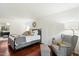 Main bedroom with hardwood floors, sitting area and access to the bathroom at 6501 E Cholla St, Scottsdale, AZ 85254