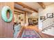 Elegant entryway with a tiled floor, wooden beams, and a view into the living area at 6501 E Cholla St, Scottsdale, AZ 85254