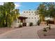 Front view of a lovely home with a brick driveway and desert landscaping at 6501 E Cholla St, Scottsdale, AZ 85254