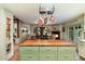 Large kitchen island with butcher block top, and views into the Gathering room and backyard at 6501 E Cholla St, Scottsdale, AZ 85254