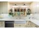 Farmhouse kitchen with white cabinets, quartz countertops and a large apron sink at 6501 E Cholla St, Scottsdale, AZ 85254