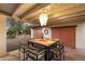 Covered patio with dining table and chairs near barn doors at 6501 E Cholla St, Scottsdale, AZ 85254