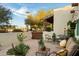 Inviting patio with comfortable seating, lush plants, and a view of the neighborhood at 6501 E Cholla St, Scottsdale, AZ 85254